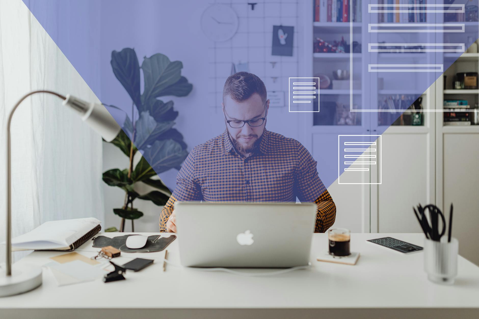 man in blue and white checkered dress shirt using silver macbook