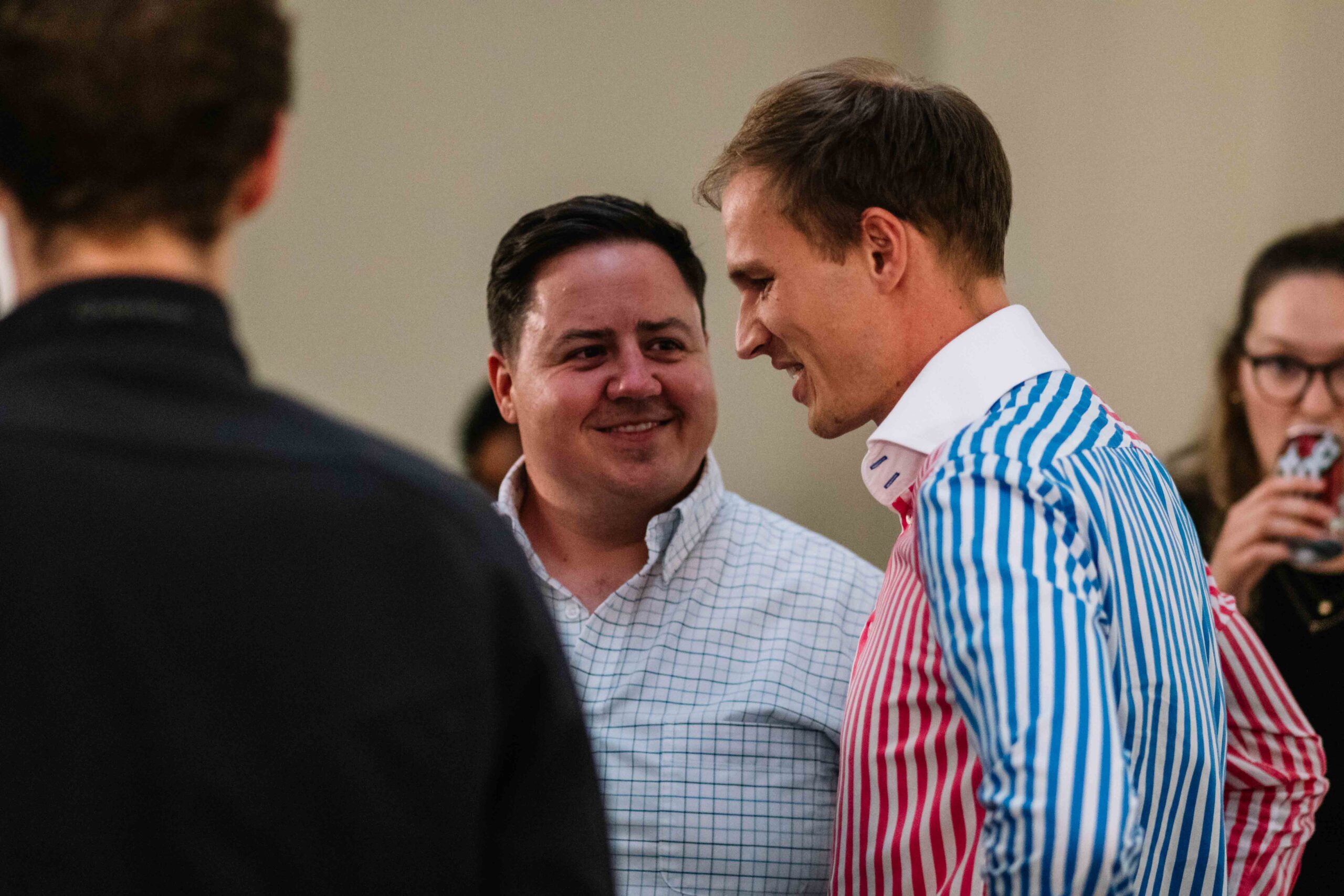 Men chatting and laughing together at IGNITE! 2022
